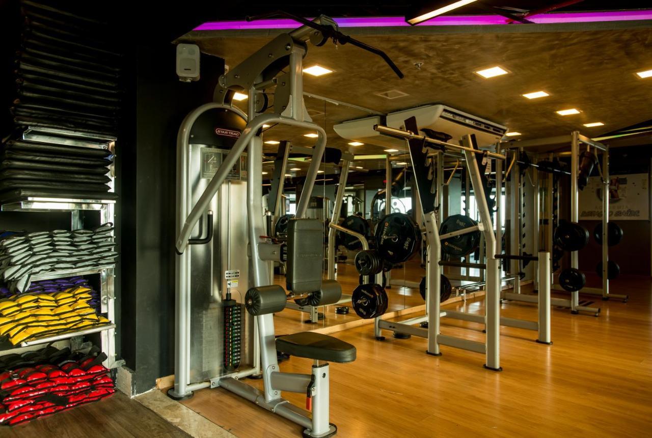 Hotel Luzeiros Sao Luis Eksteriør billede The photo depicts a modern gym interior. It features various workout equipment, including a weight machine designed for strength training. The gym has a clean and organized layout, with wooden flooring and bright lighting. In the background, there ar